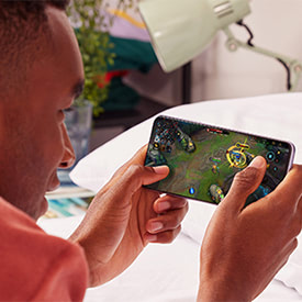 Man playing a game on the Samsung Galaxy A22 5G