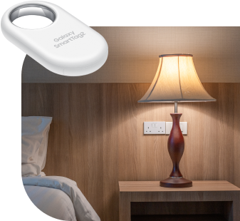 bed side table with dull orange light, a large smart tag shown in the top left