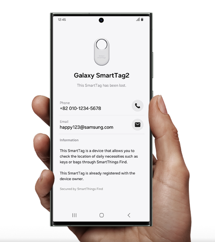 a hand holding a phone with the smart tag app